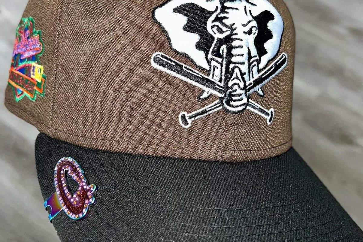 Detailed view of custom enamel hat pin design with multiple colors and finishes